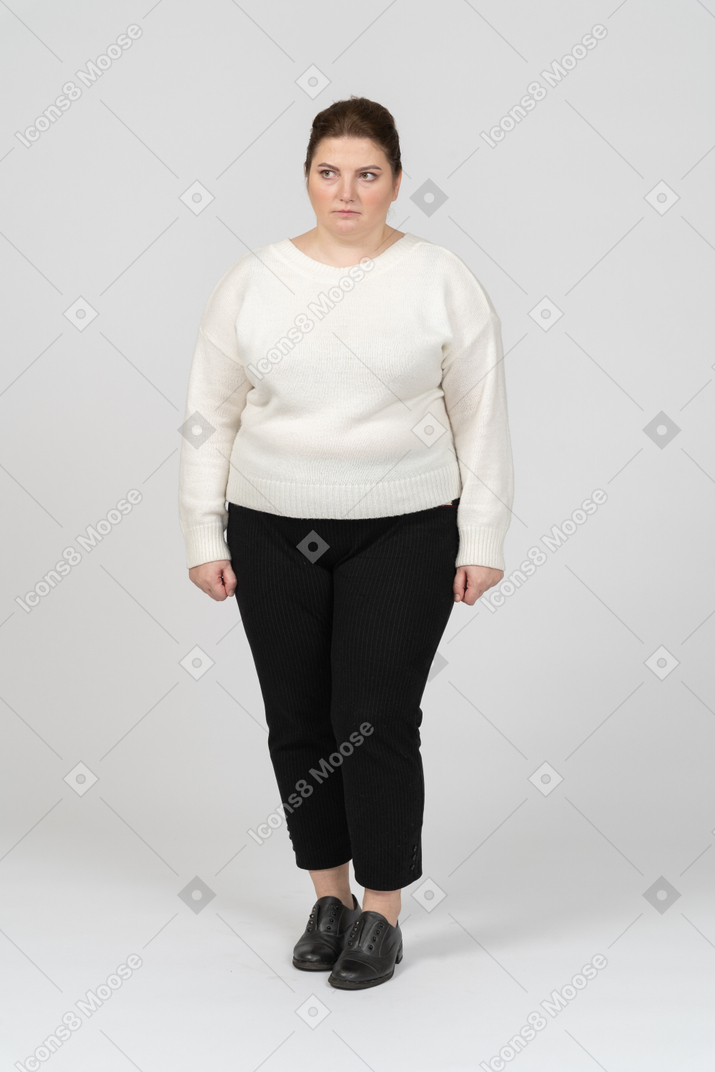 Sad plump woman in white sweater
