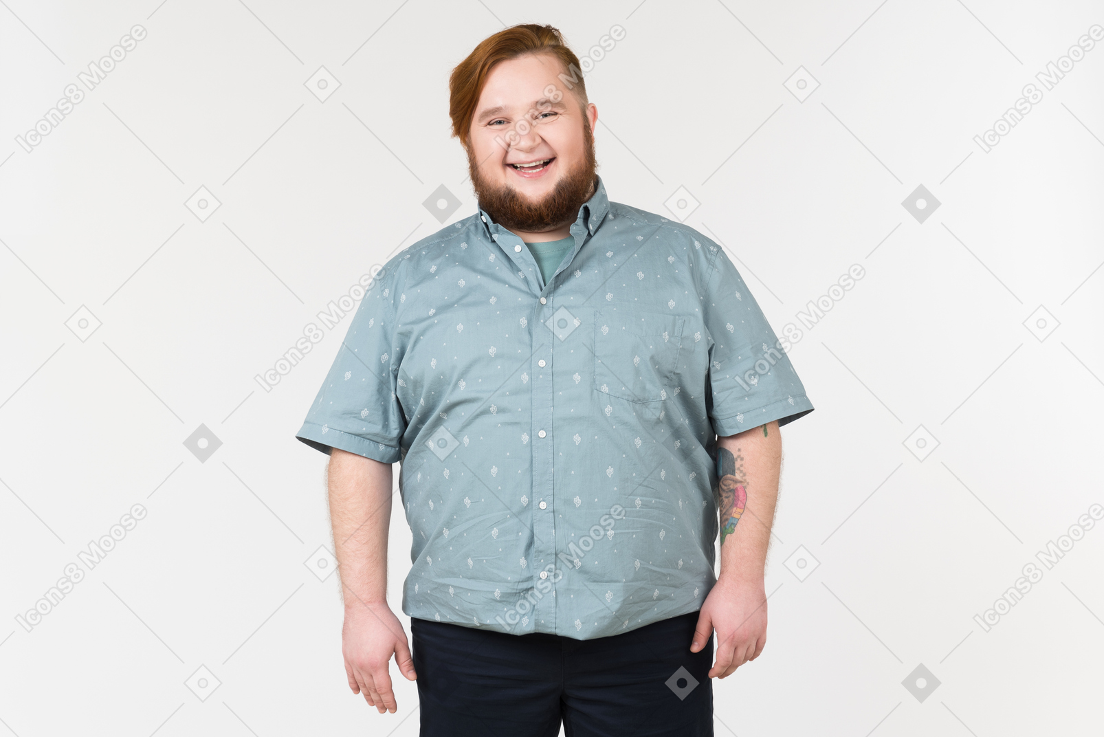 A fat man standing and smiling widely