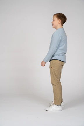 Happy boy standing in profile