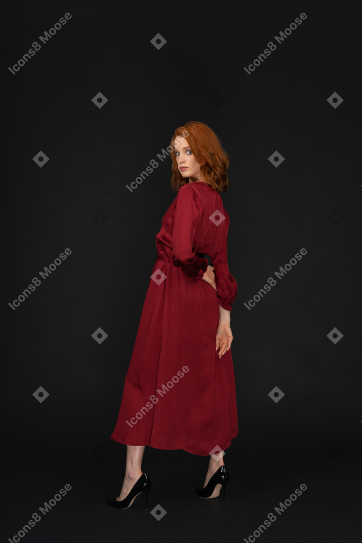 Lady dressed in red and looking at camera