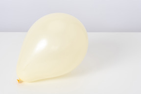 Yellow balloon on a white background