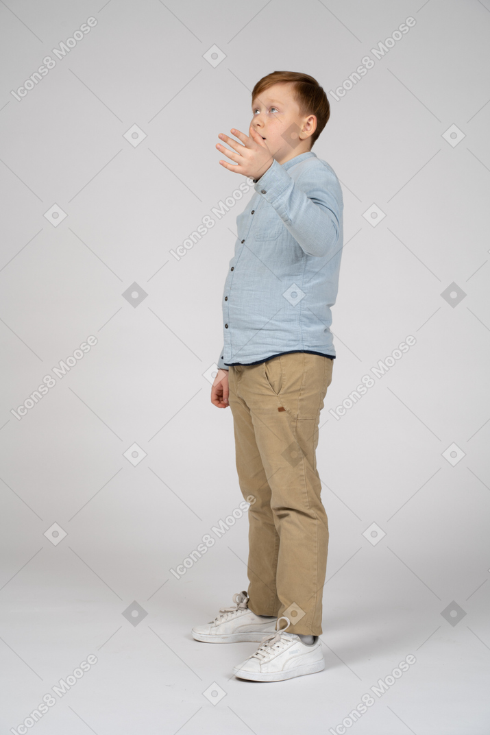Boy in shirt and pants talking