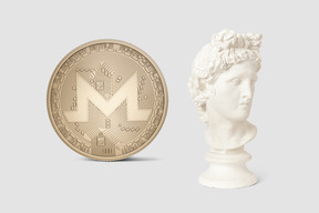 A white bust of a man next to a gold coin