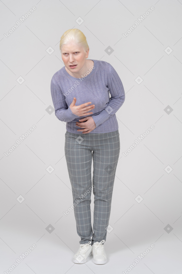 Young woman groaning with stomachache