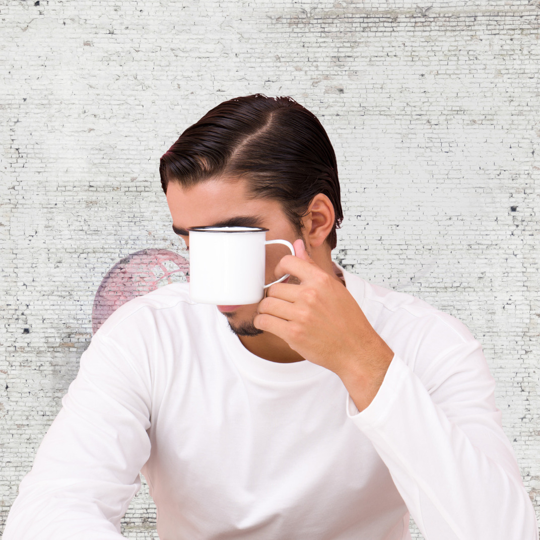 Young man with a cup of coffee