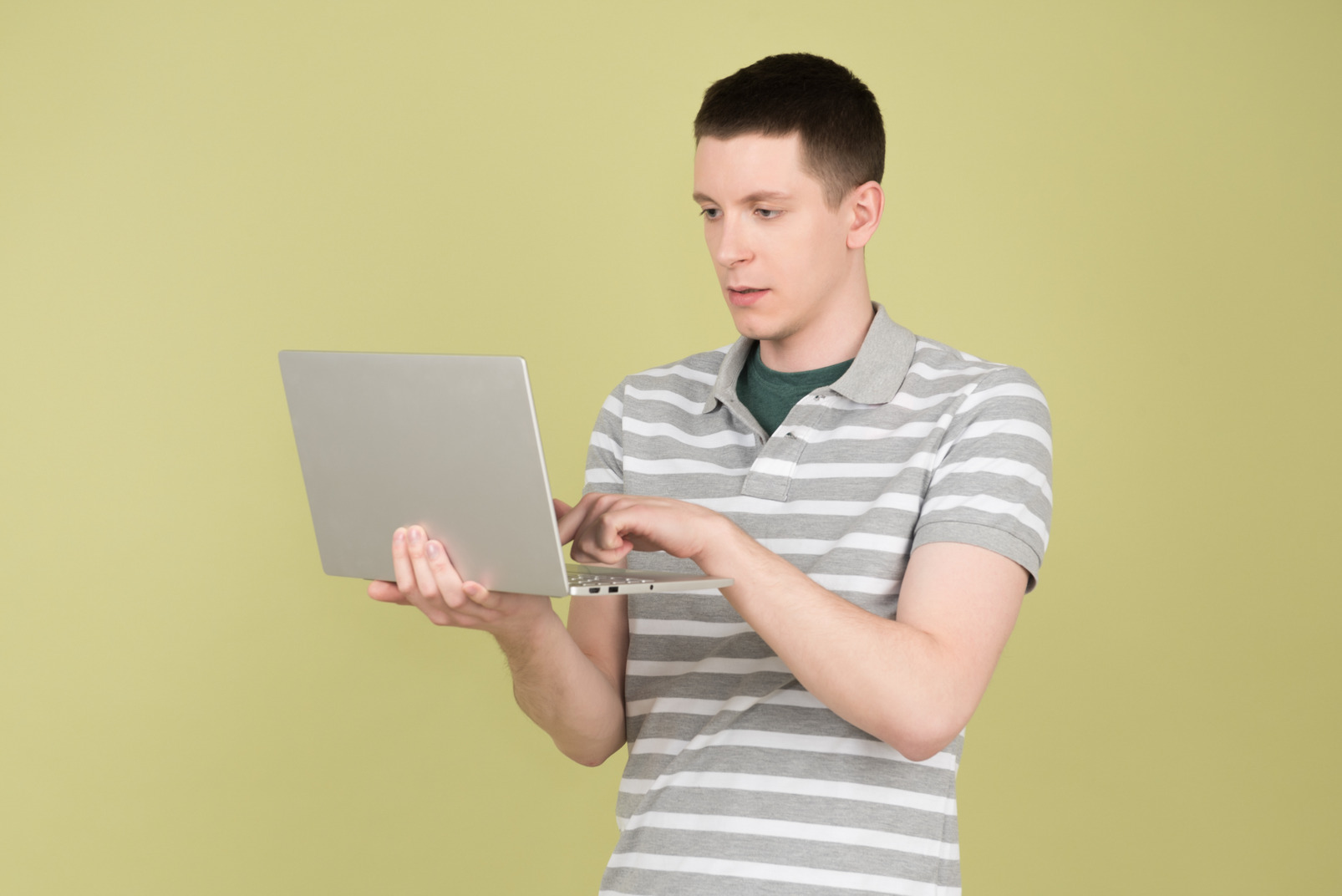 Young man holding a laptop