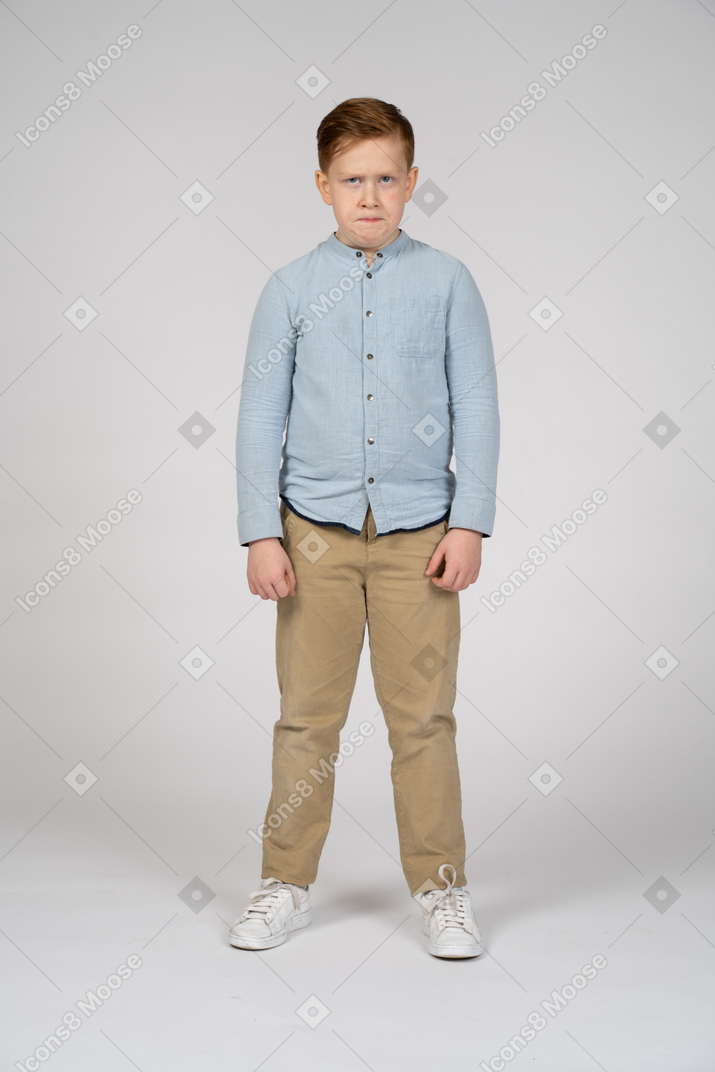 Front view of an angry boy looking at camera