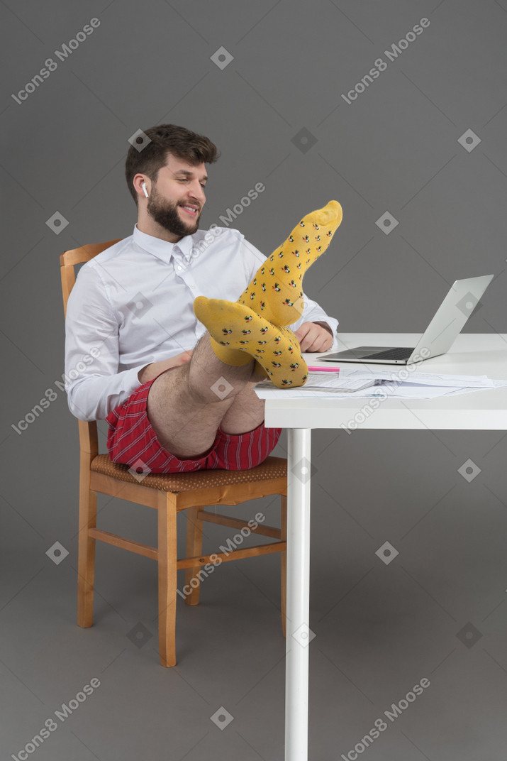 Cheerful businessman participating in online conference