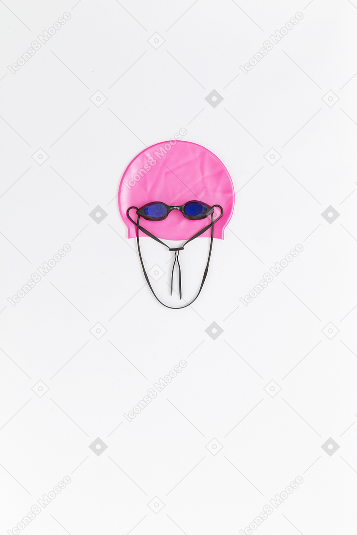 Funny face made of swimming accessories