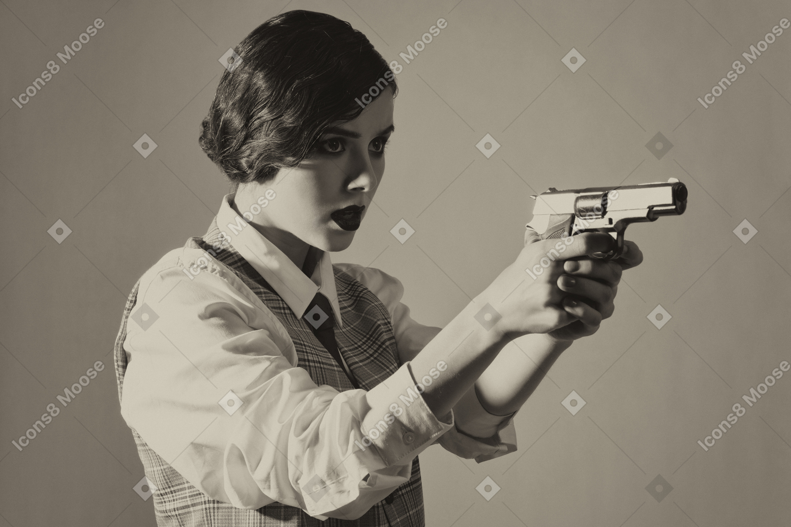 Woman holding a gun with both hands