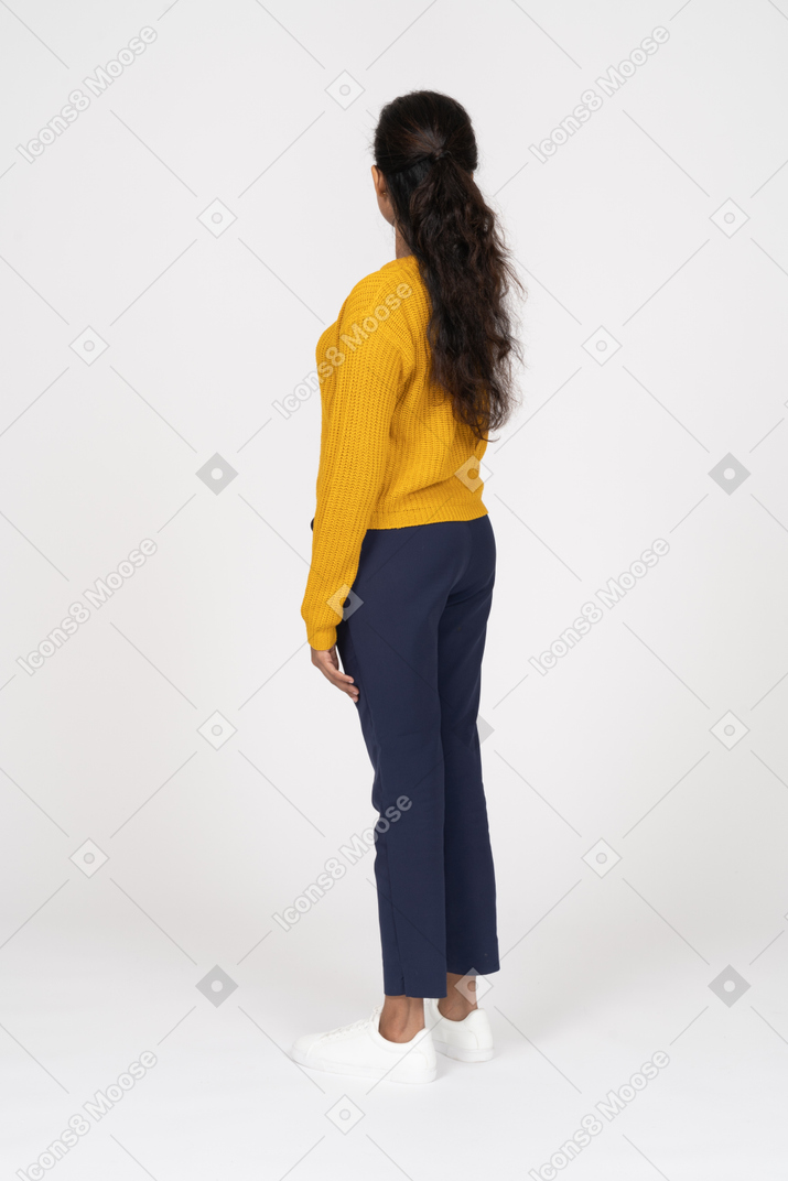Side view of a beautiful girl in casual clothes