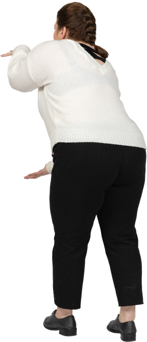 Plump woman in casual clothes gesturing