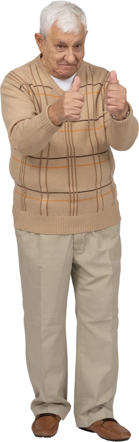 Front view of a happy old man in casual clothes showing thumbs up
