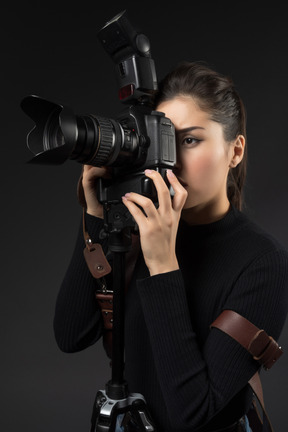 Female photographer using a camera