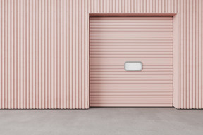 Pink roll up door of a closed shop
