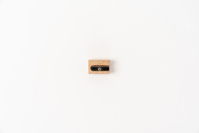 Wooden pencil sharpener on white background