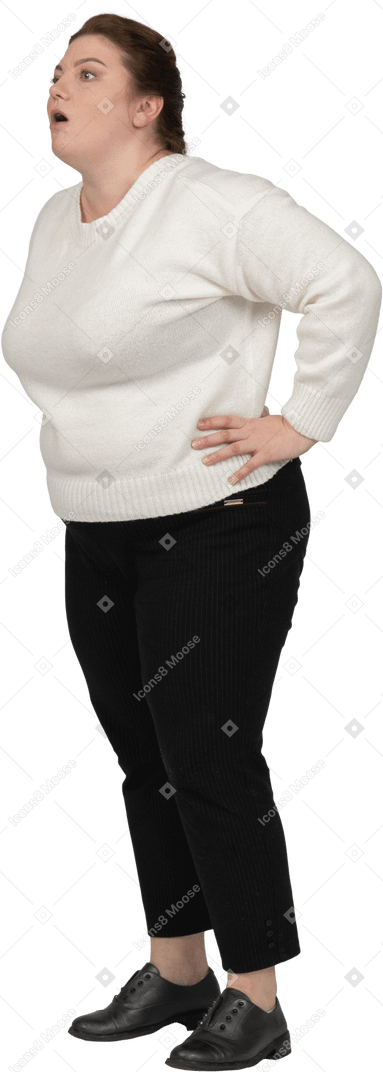 Side view of an impressed plus size woman in casual clothes