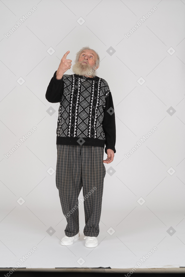 Old man looking and pointing up