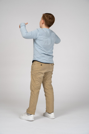 Back view of a boy gesturing
