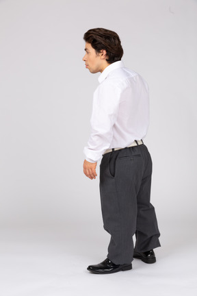 Three-quarter back view of an office worker looking away