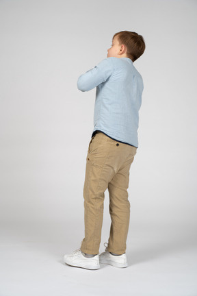 Back view of an impressed boy