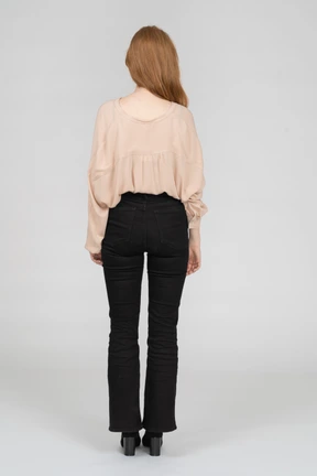 Back view of young woman standing