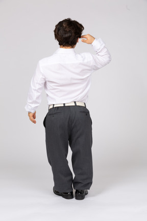 Back view of a man saluting