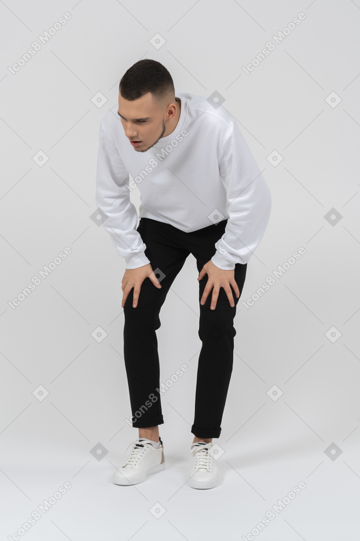 Man in casual clothes looking exhausted
