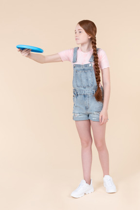 Teenage girl holding frisbee