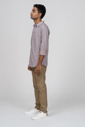 Young man in casual clothes standing