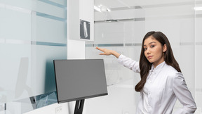 A female doctor pointing at the screen