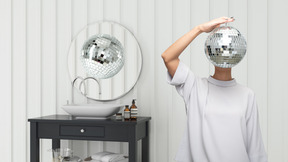 A person with a disco ball on their head