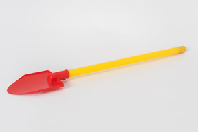 Colourful shovel on white background