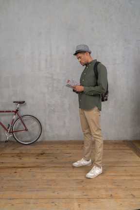 Tourist taking notes in notebook