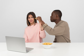 Attractive couple watching some show online together