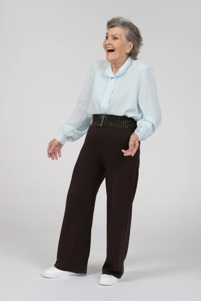Three-quarter view of an old woman laughing