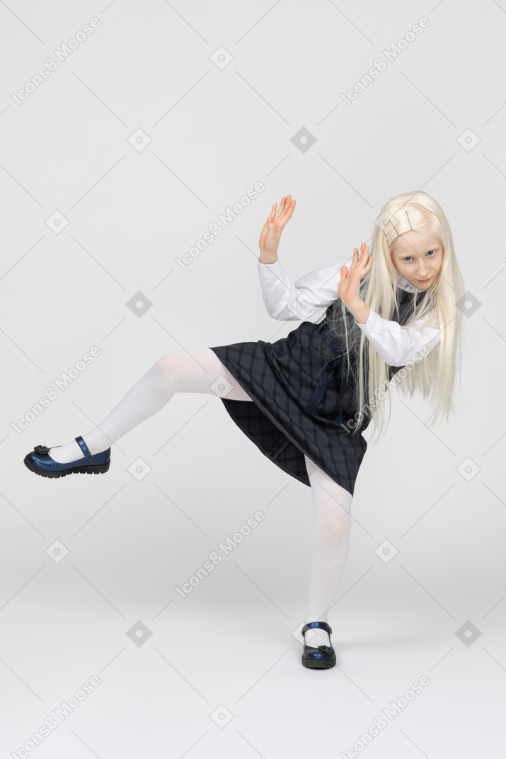 Schoolgirl trying to get away and putting hands up