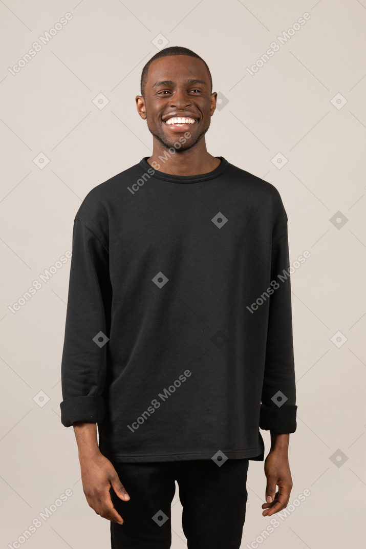 Young man looking at camera and smiling