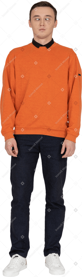 Young man in orange sweatshirt standing