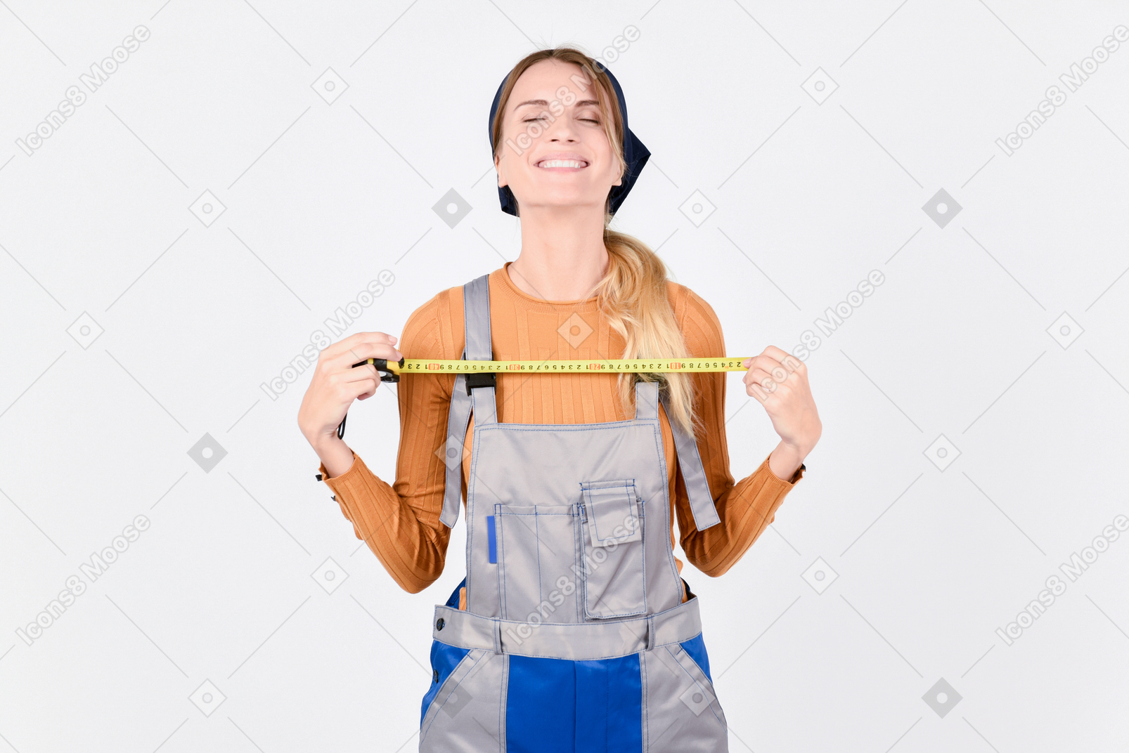 Female plumber holding ruler