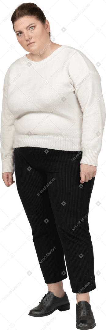 Plump woman in casual clothes looking at camera