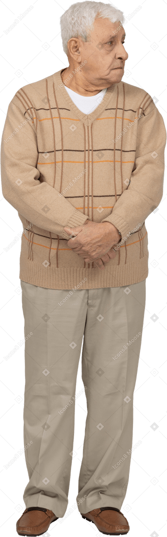 Front view of an old man in casual clothes looking aside