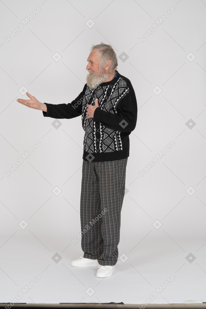 Cheerful elderly man outstretching his arm