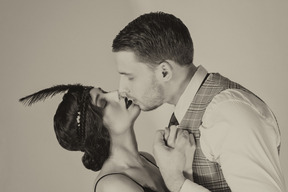 Stylish gentleman kissing his girlfriend