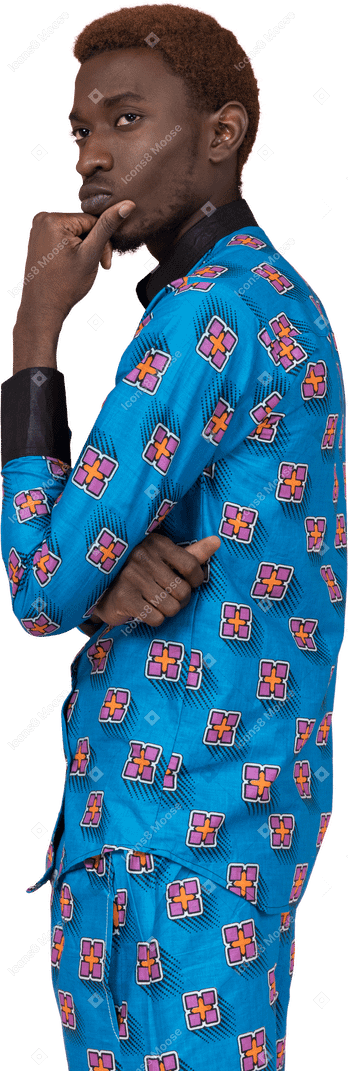 Black man in blue pajamas looking