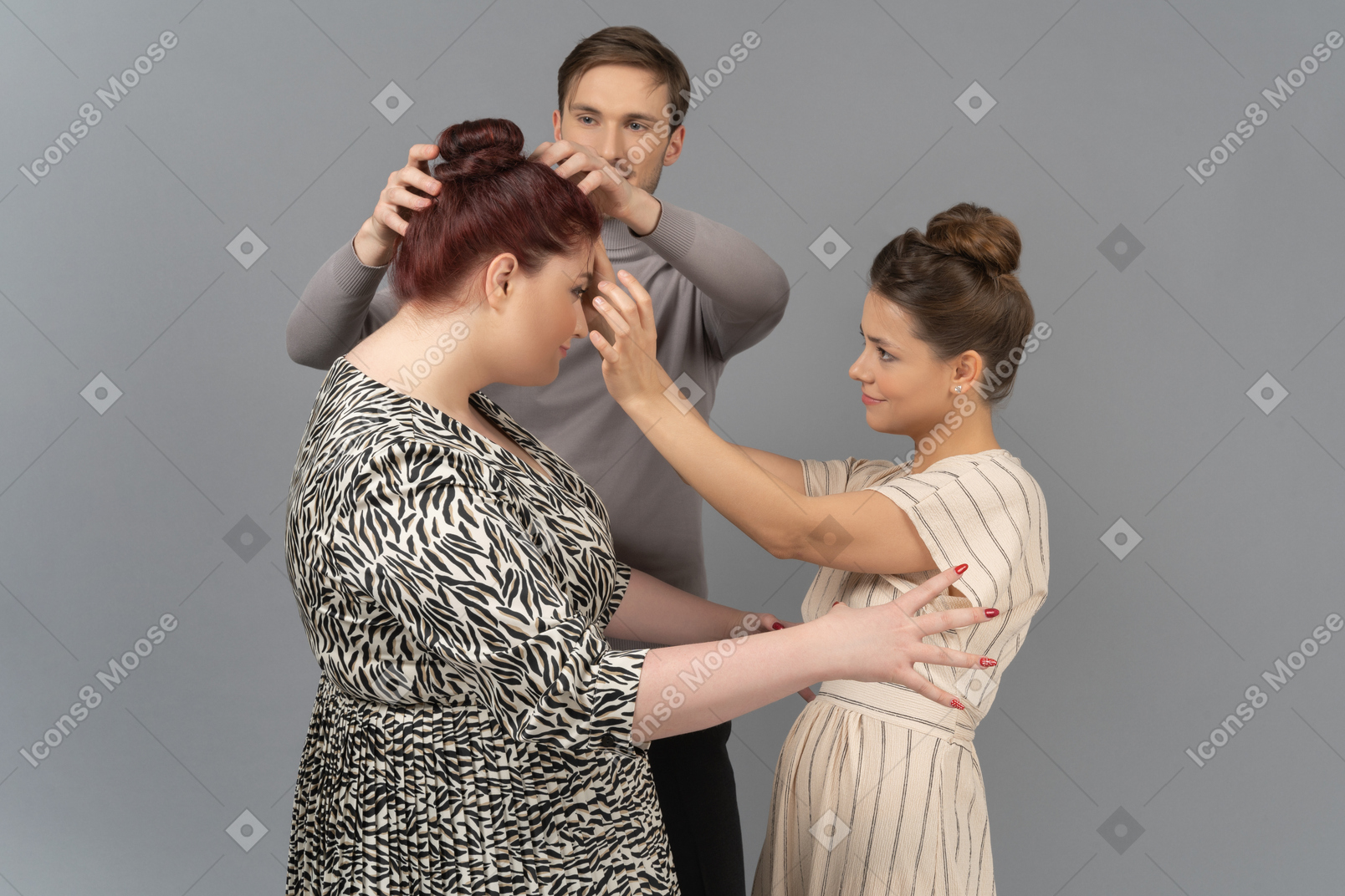 Young couple fixing woman's haircut