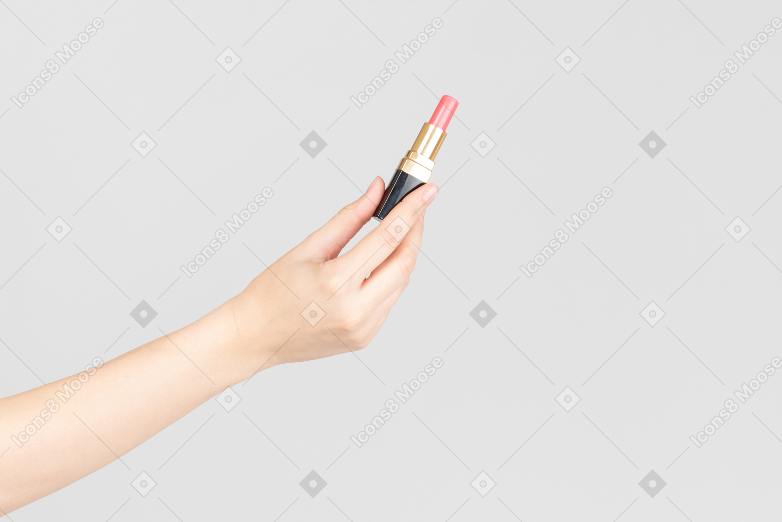 Female hand holding pink lipstick
