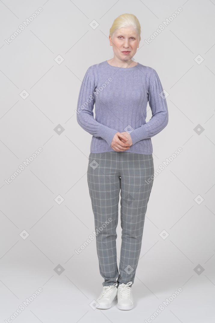 Suspicious young woman folding hands