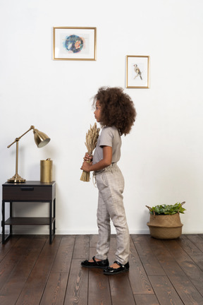 Cute girl posing on the background of the apartment