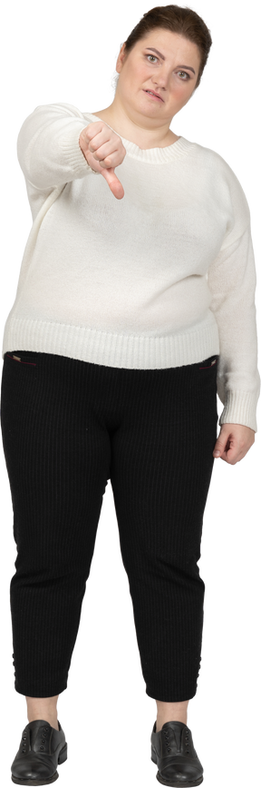 Plus size woman in casual clothes showing thumb down